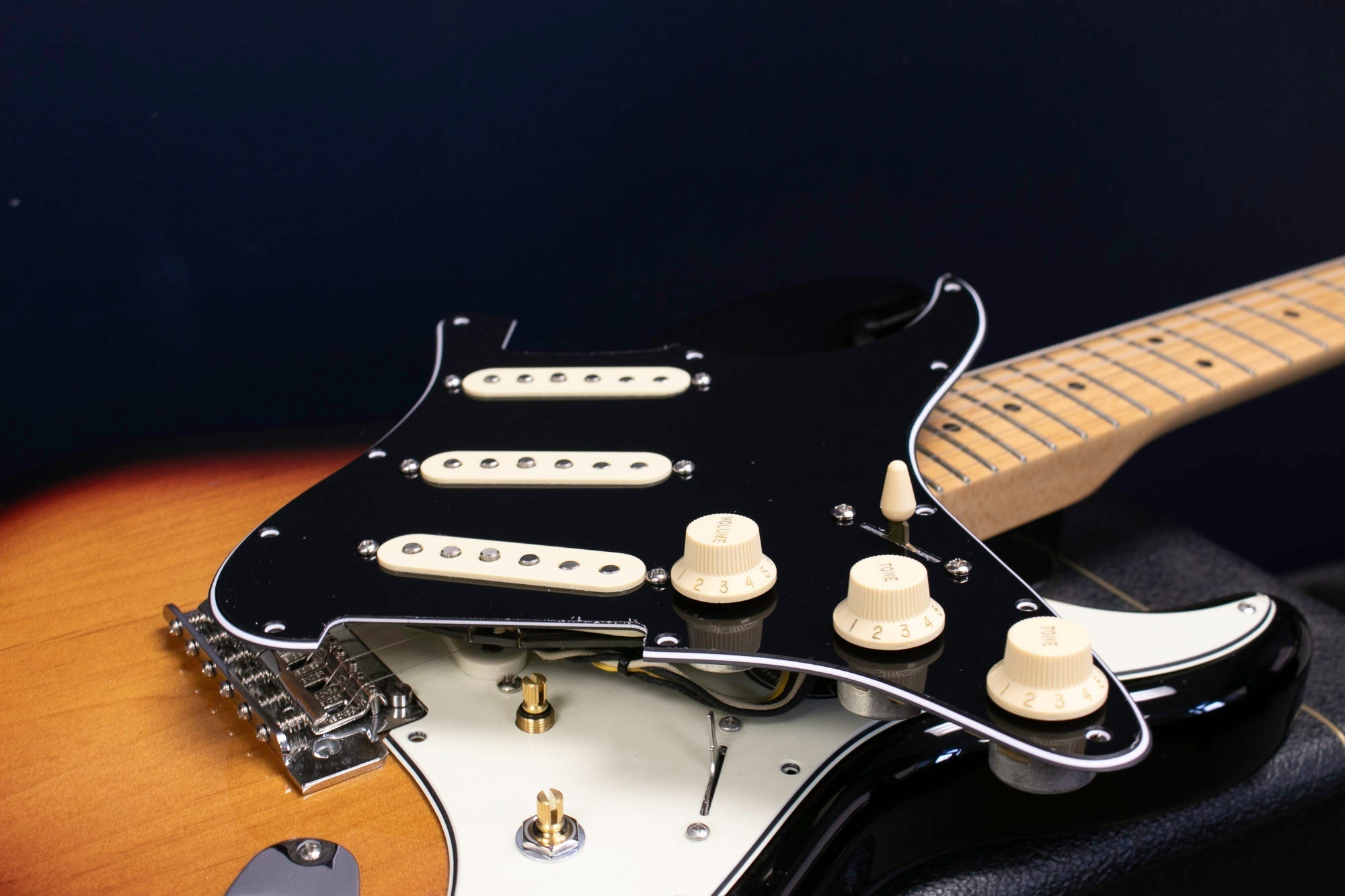 ObsidianWire Pickups with white covers on a a black stratocaster