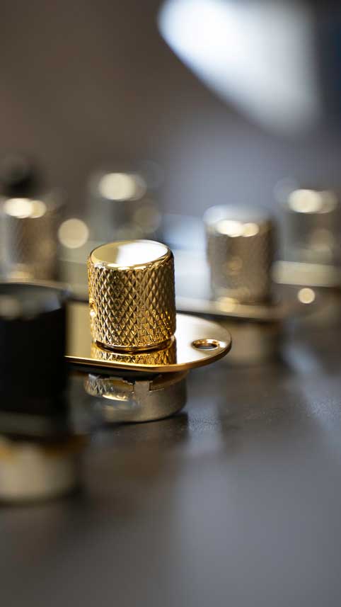 gold telecaster loaded control plate on a textured surface
